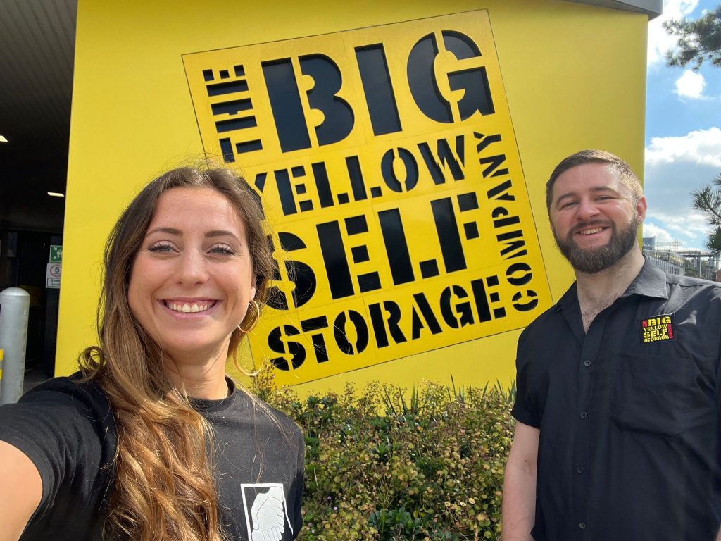 selfie in front of the big yellow sign