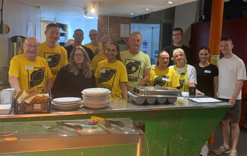 a group of people who volunteer at Lifeshare homeless charity in manchester