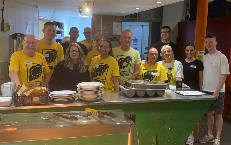a group of people who volunteer at Lifeshare homeless charity in manchester